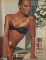 beautiful tan woman in a black bikini in a 1980's ad for sunscreen