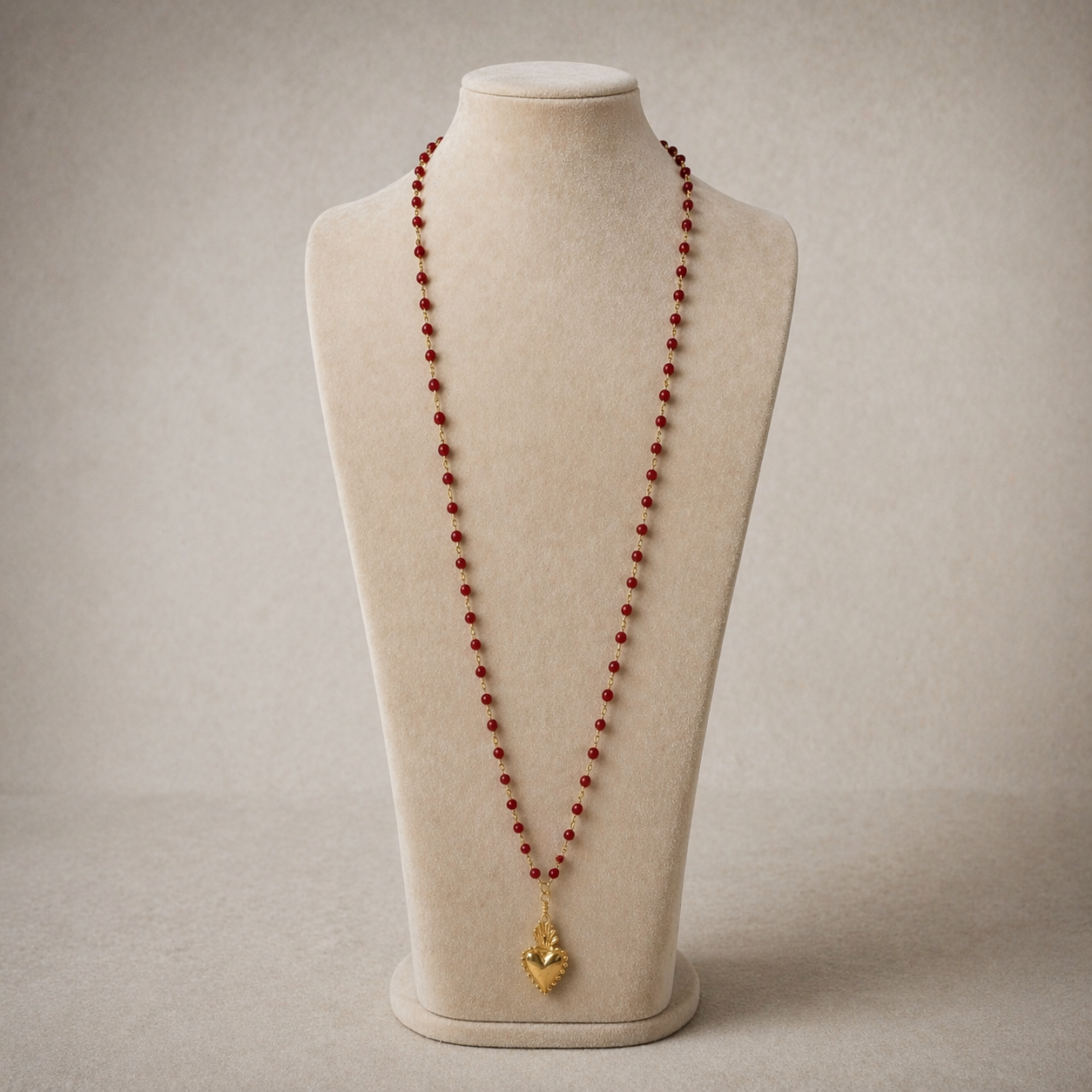 Coral bead necklace and ex voto heart